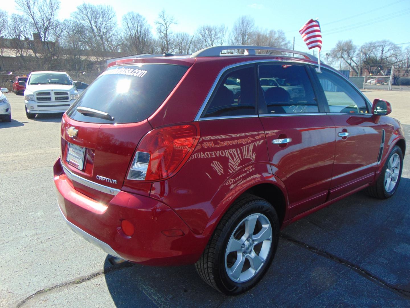 2015 Red Chevrolet Captiva Sport (3GNAL3EK6FS) with an 4-Cyl Flex Fuel 2.4 Liter engine, Automatic, 6-Spd transmission, located at 2105 Dixie Hwy, Louisville, KY, 40210, (502) 772-3333, 38.220932, -85.795441 - Photo#9